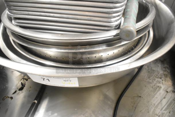 Lot of metal baking pans, stainless steel drop-in bins, and metal bowls; auction tag numbered 71 visible.