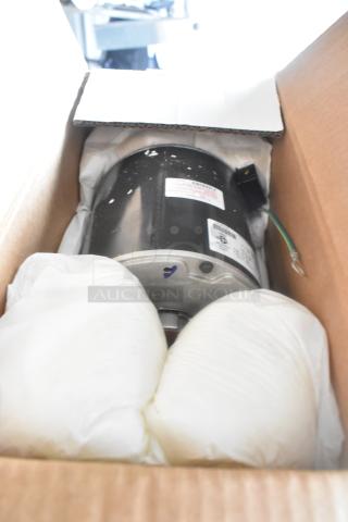 Boxed US Motors LX7922 460/380-420V, and 1412 460V. Scratch and dent, new condition. Labels with specs visible.