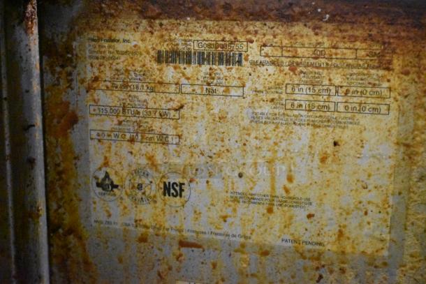 Pitco Frialator 40D commercial fryer plaque, showing model, 115,000 BTU rating, and rusted surface details.