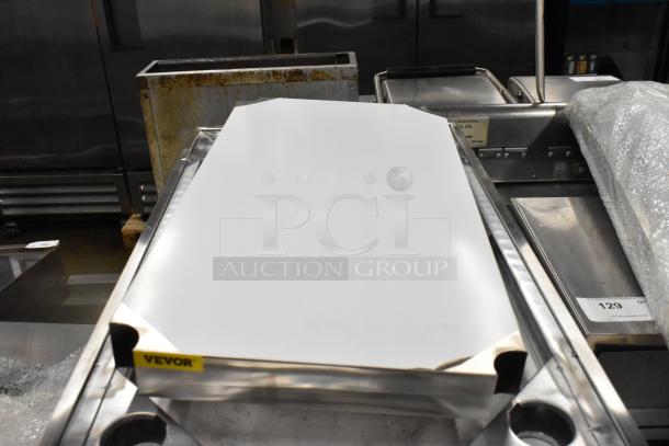 BRAND NEW SCRATCH AND DENT! Stainless Steel Tabletop w/ Under Shelf, Metal Legs and Commercial Casters. - Image 4 of 7