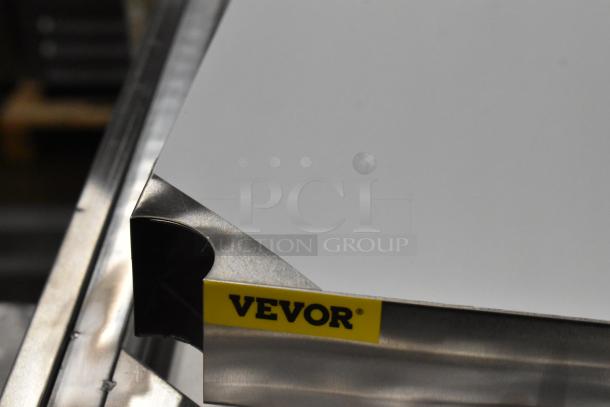 BRAND NEW SCRATCH AND DENT! Stainless Steel Tabletop w/ Under Shelf, Metal Legs and Commercial Casters. - Image 5 of 7