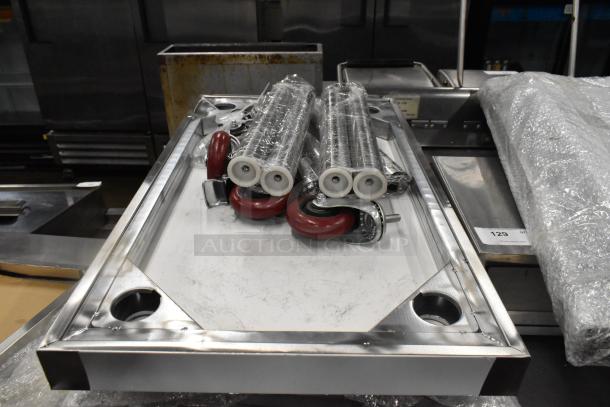BRAND NEW SCRATCH AND DENT! Stainless Steel Tabletop w/ Under Shelf, Metal Legs and Commercial Casters. - Image 6 of 7