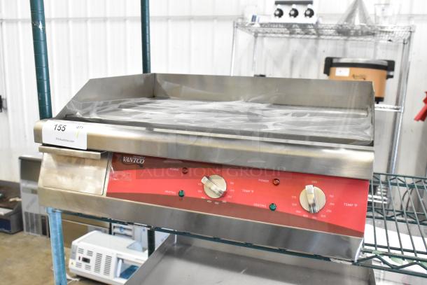 Brand new Avantco 177EG24N 24" stainless steel electric countertop griddle, 208/240V, showing control panel and tags.