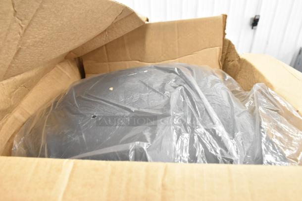 Box with 160 Choice 72" round white spun polyester tablecloths and black seat cushions. Condition: scratch and dent.
