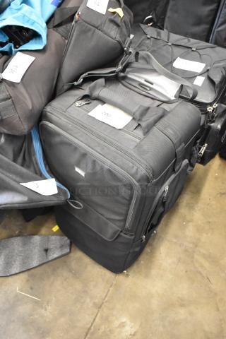 Basecamr case with Pelican screen protector and power converters, black, multiple zippered compartments, good condition.