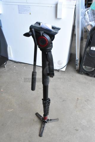 Manfrotto MVM500A tripod, adjustable monopod with fluid video head, good condition, black and red accents.