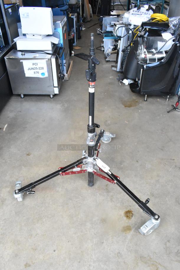 Matthew B339761 Tripod, industrial-grade, with wheeled base and adjustable height. Good condition with visible labels.