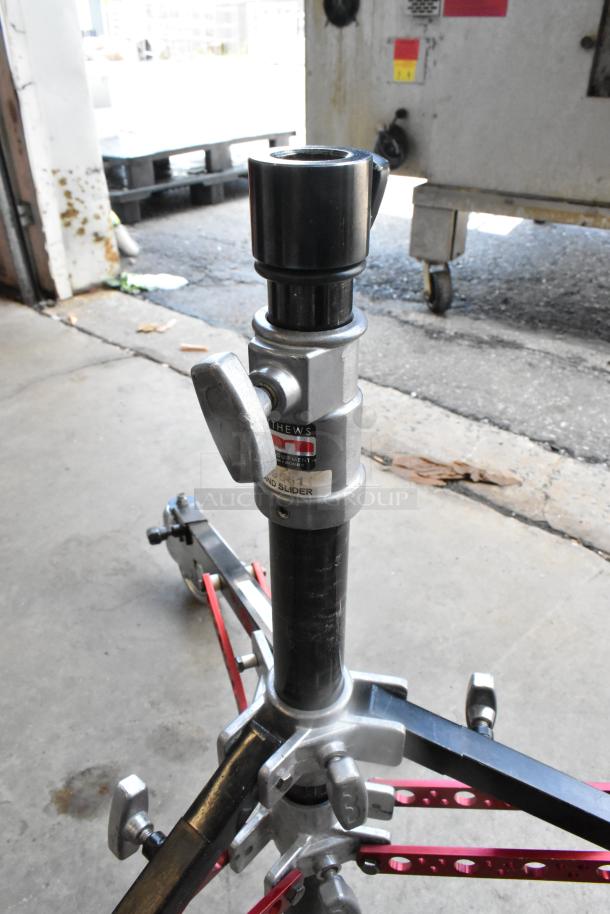 Matthew 249561 Stand Slider Tripod on Casters, sturdy build, adjustable height, visible label, good condition.