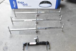 Alt text: Lot of metal pieces including chrome bars and a labeled "Double Header" part, with a Phottix Raja 105 softbox box in background.