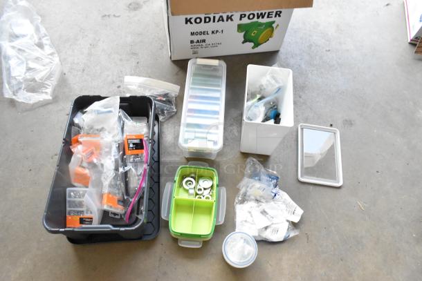 Lot of miscellaneous items including washer kits, lock nuts, and assorted hardware, in various containers. Kodiak Power box visible.
