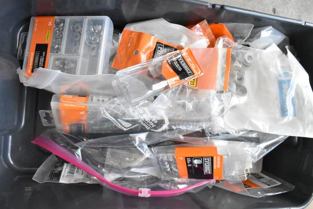 Lot of various items including Everbilt washer kits and lock nuts in original packaging, assorted sizes, new condition.