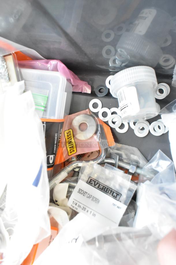 Lot of various items including washer kits, lock nuts, and screws. Visible labels include "Everbilt" and "Stainless".