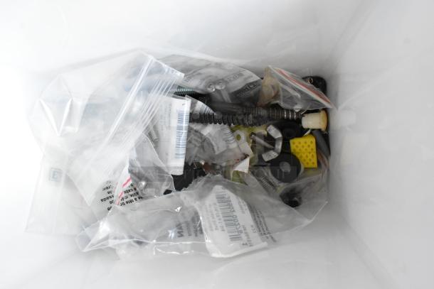 Lot of various items in plastic bags, including washer kits, lock nuts, and hardware components. New condition.
