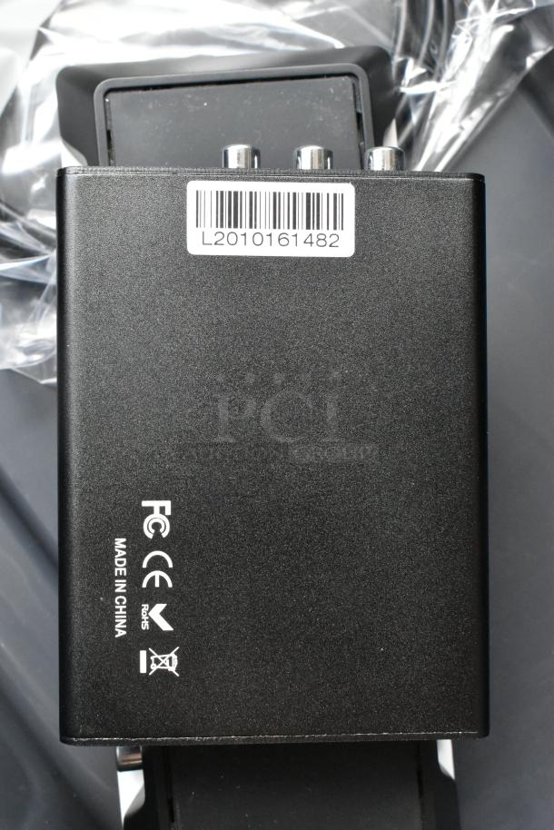 HDMI video converter in poly bin. Black casing with label "L2010161482." Markings indicate "Made in China," FC and CE certified.