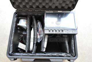Flanders Scientific Zunzheng BM090 Broadcast Monitor with wires, housed in a durable hard case.