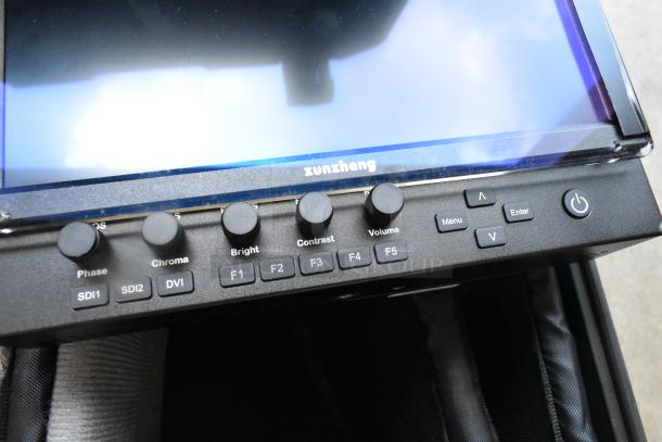 Flanders Scientific Zunzheng BM090 Broadcast Monitor, controls visible, in hard case with wires, excellent condition.