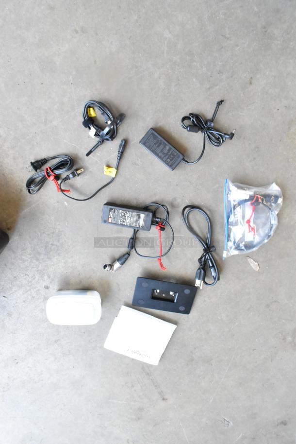 Flanders Scientific Zunzheng BM090 Broadcast Monitor accessories, includes power cables, connectors, in a hard case.
