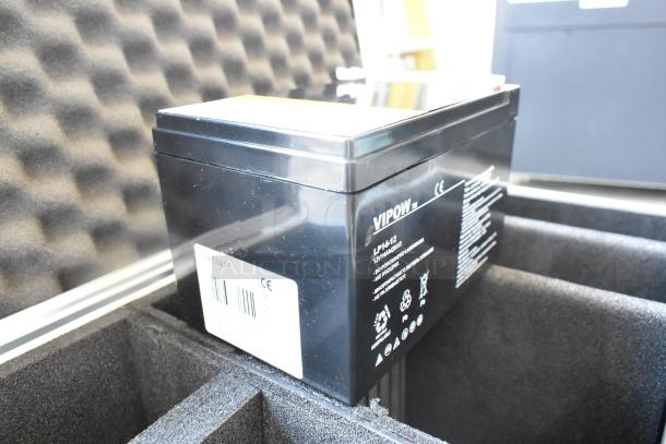 Vipow LP14-12 battery in hard case. Black, 12V, markings indicate model and compliance. Protective foam lining.