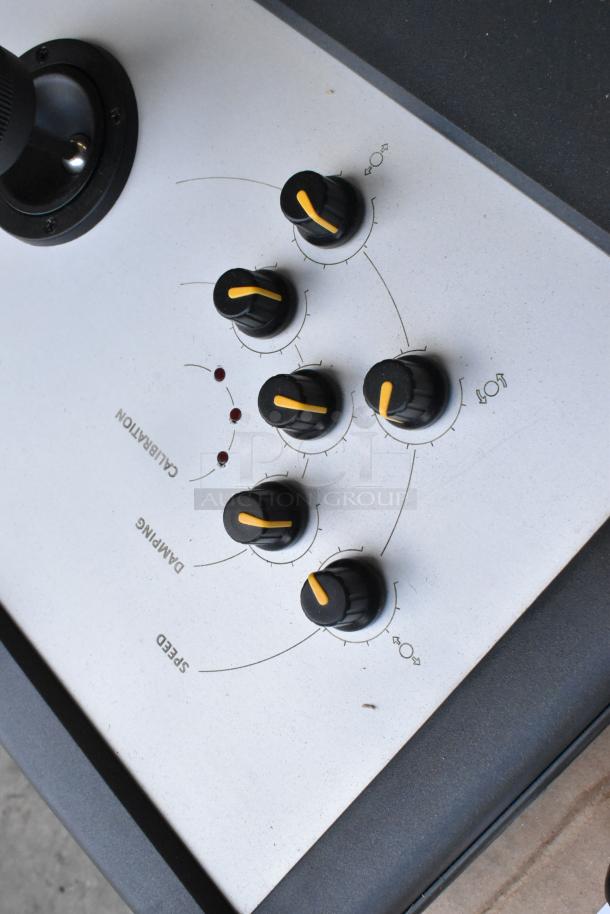Ditogear TRI-B-210 Motion Control Slider, showing control panel with calibration, damping, and speed knobs.