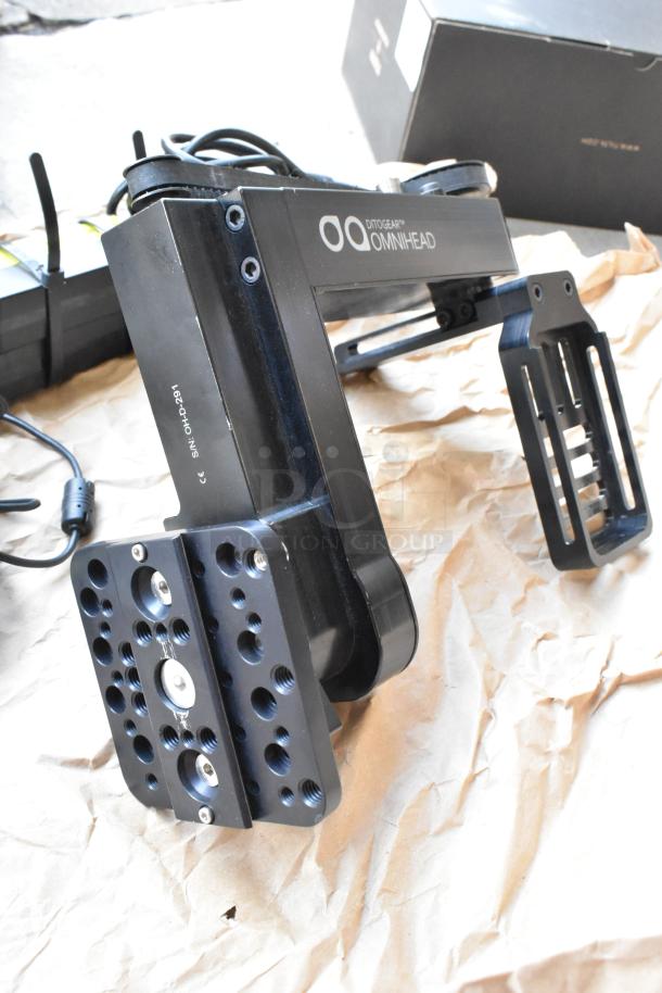 Ditogear Omnihead unit with Nucleus Wireless Lens Control System, in used condition, shows black finish and labeled markings.