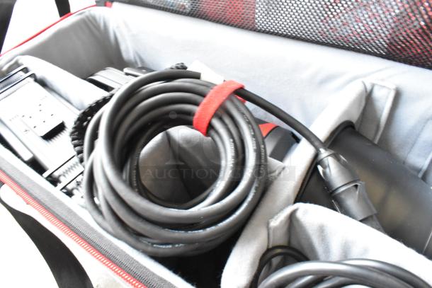 Aputure 300 II Daylight Monolight with Light Storm COB 300 II, coiled cables, secured in protective carrying case.