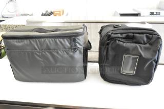 Two soft bags; gray and black. The gray bag has a top handle, and the black bag features a front ID slot. Both in good condition.