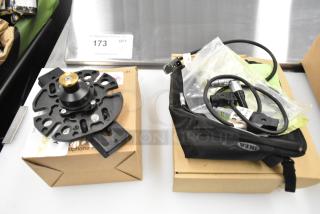 Movi Ninja Star with cable, includes mounting hardware on a cardboard box. Additional cable in a black pouch.