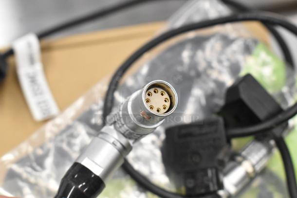 Close-up of a Movi Ninja Star with a multi-pin connector cable. Items are in good condition, enhancing functionality.
