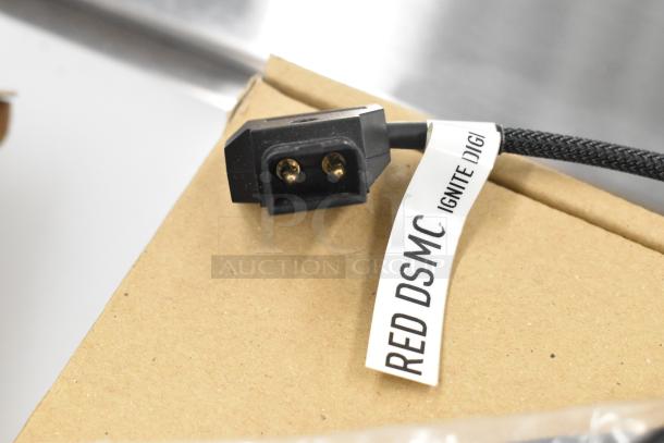 Cable with "RED DSMC IGNITE DIGI" label, black connector, part of auction item with Movi Ninja Star. Includes 2 items.