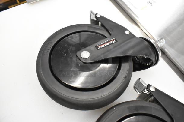 Box of 3 commercial casters, brand "Kessler," with sturdy black wheels, size 6x1.1/4, in new condition.