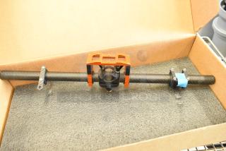 Freefly Movi Pro in box, featuring a carbon fiber handle and orange mounting system, in excellent condition.