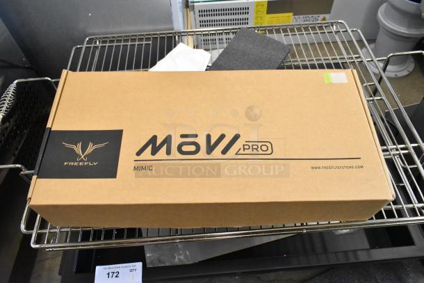 Freefly Movi Pro boxed set on a metal rack, featuring branded packaging. Appears in excellent condition.