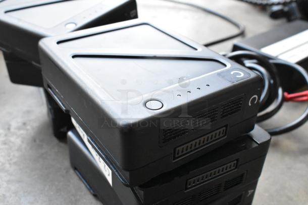 IDX VL-2X 2ch Sequential Quick Charger with rechargeable battery in case; shown in good condition with visible cables.