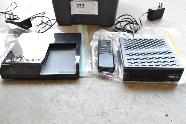 Seagate FreeAgent Theater Roku digital video player with remote, power adapter, and dock in good condition.