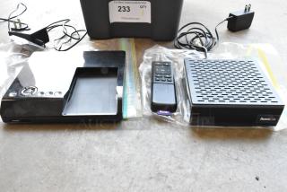 Seagate FreeAgent Theater Roku digital video player with remote, power adapter, and dock in good condition.