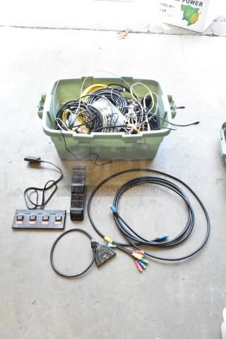 Lot of Anki unit and wiring in a green poly bin, includes cables and connectors, used condition, mixed colors.