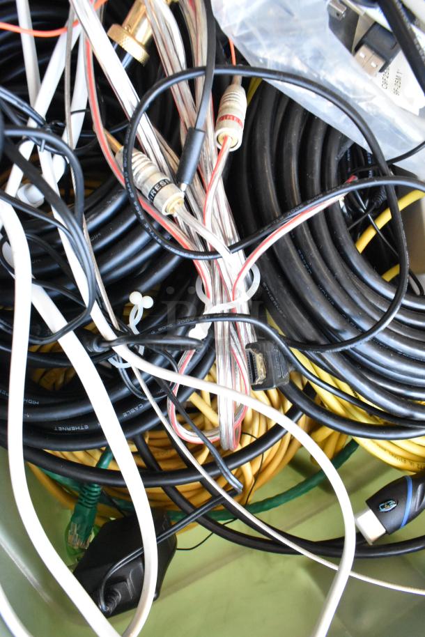 Lot of Anki unit and assorted cables in poly bin, including HDMI and Ethernet wires. Mixed condition, suitable for parts.