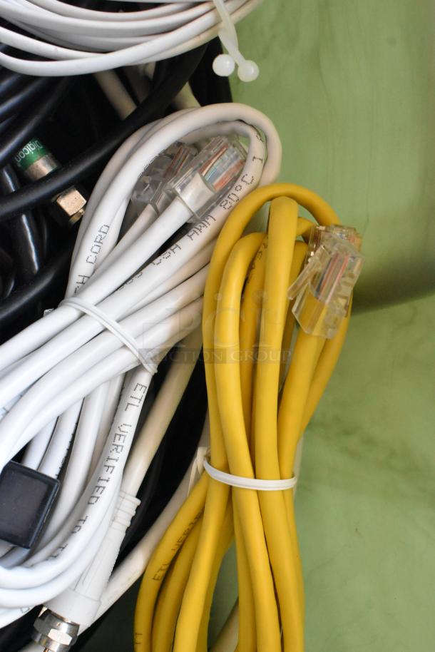 Lot of coiled Anki unit wiring in poly bin, includes black, white, and yellow cables with connectors, labeled ETL verified.