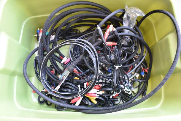 Lot of assorted wiring in a green poly bin, featuring various cables with multicolored connectors in good condition.
