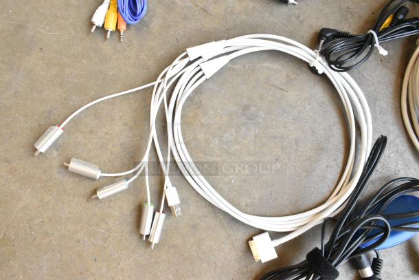Lot of assorted wiring in poly bin, including white cables with connectors and black cords. Ideal for electronics projects.