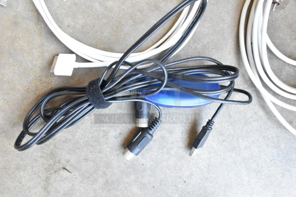 Lot of mixed wiring in a poly bin, includes USB and audio cables. Good condition, black and white cables shown.