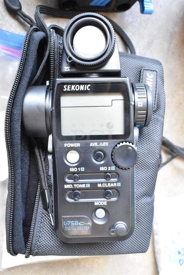 Lot with Sekonic L-758 Digital Master, adapter plates, and Frotto 396B-2 in poly bin; lightly used condition.