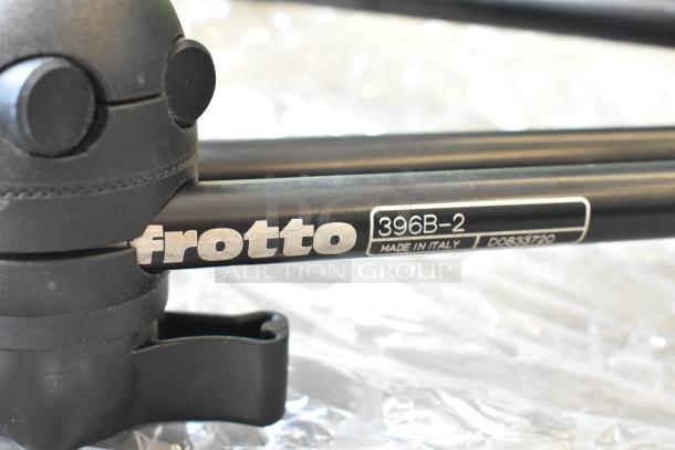 Alt text: Frotto 396B-2 extension arm with visible label, black finish, "Made in Italy," light scuffs, part of varied auction lot.
