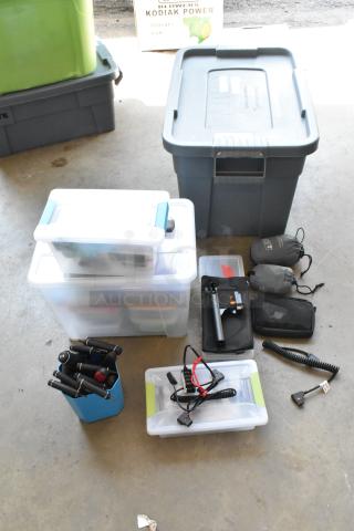 Lot including Movi Pro Pop-n Lock, multiple storage bins, and assorted accessories in a garage setting.
