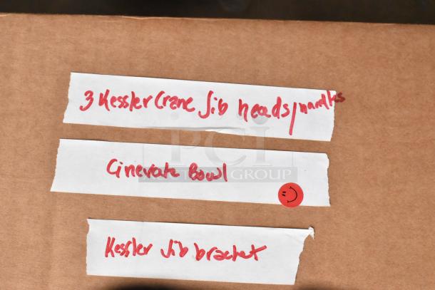 Labels on a cardboard box listing "3 Kessler Crane Jib heads," "Cinevate Bowl," and "Kessler Jib bracket."
