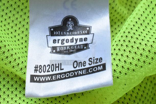 High visibility vest tag showing "Ergodyne Work Gear," model #8020HL, one size, in bright lime mesh fabric.
