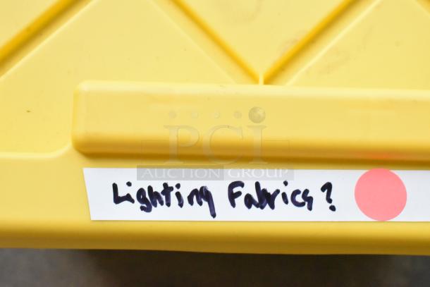 Yellow hard poly bin labeled "Lighting Fabrics?" containing Westcott fabric.