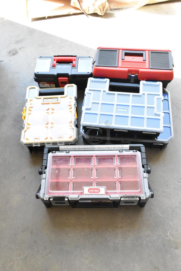 Lot of various hard cases including brands like DeWalt, Kobalt, Keter, and Tough. Different sizes, used condition.