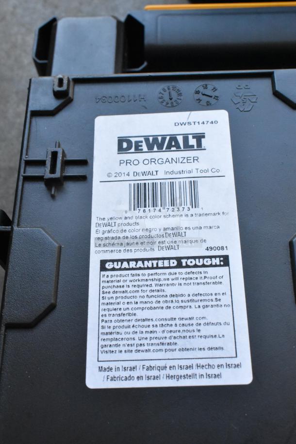 DeWalt Pro Organizer hard case, black with yellow accents. Label details warranty and origin: Made in Israel. Model DWST14740.