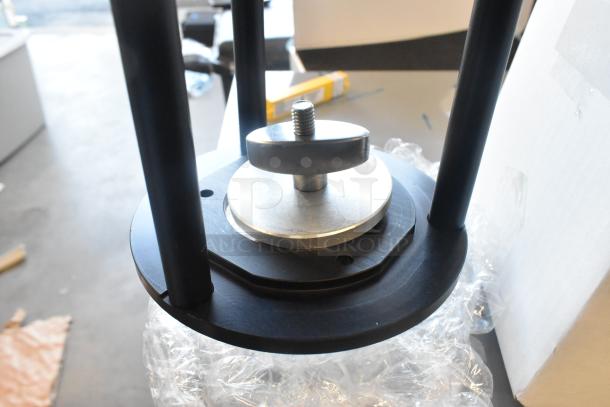 Dana Dolly Camera Riser, black metal, with adjustment knob, in excellent condition, on bubble wrap.